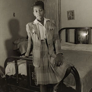Adopted daughter of Mrs. Ella Watson, a government charwoman, Washington, D. C. 1942. Creator: Gordon Parks