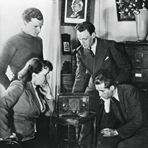 French citizens listening to a broadcast by Vichy deputy premier Admiral Darlan, 23 May, 1941