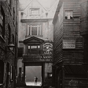 View of the gateway to the Oxford Arms Inn, Warwick Lane, City of London, 1875. Artist