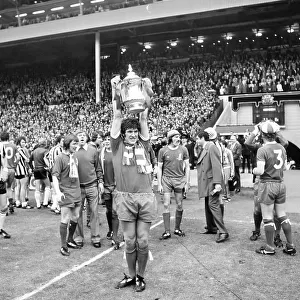 Liverpool v Newcastle United 1974 FA Cup Final at Wembley Stadium. Emlyn Hughes with the Cup for Liverpool