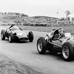1958 Dutch Grand Prix: Mike Hawthorn, Ferrari Dino 246, 5th position, leads Jean Behra, BRM P25, 3rd position, action