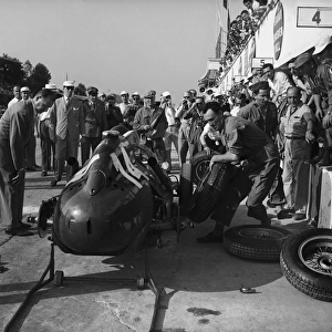1958 Italian Grand Prix: Mike Hawthorn, 2nd position, pit stop in which both rear tyres were changed, action
