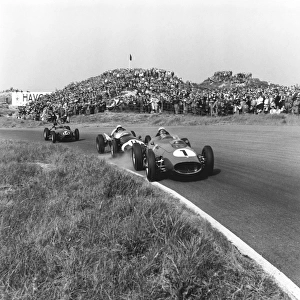 1959 Dutch Grand Prix: Jean Behra, 5th position leads Stirling Moss, retired, and Graham Hill, 7th position, action