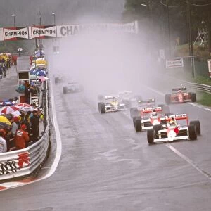 1989 Belgian Grand Prix: Ayrton Senna enters La Source at the start followed by teammate Alain Prost, Gerhard Berger, Thierry Boutsen and Nigel