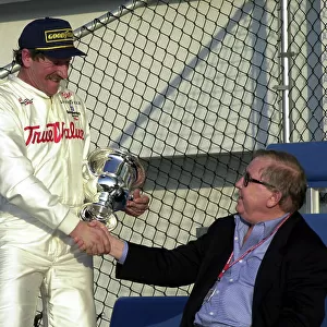2000 Daytona 500, IROC Race, February 18, 2000, Daytona, FL, USA Bill France congratulates Dale Earnhardt on his IROC victory -podium/portrait. 2000, Michael L. Levitt, USA LAT PHOTOGRAPHIC
