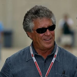 Formula One World Championship: Mario Andretti talks with Pierre Dupasquier Michelin Director of Worldwide Racing