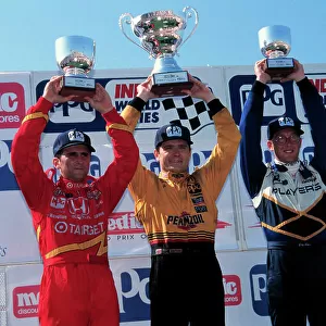 GREG MOORE On the podium with Zanardi and Deferran. Cleveland 96 1999, Michael L. Levitt, USA LAT PHOTOGRAPHIC