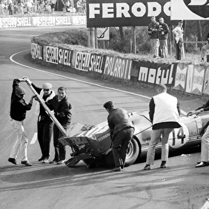 Le Mans 24 Hour Race: The Scuderia Filipinetti Ford GT40 of Peter Sutcliffe and Dieter Spoerry is removed from the circuit after crashing out