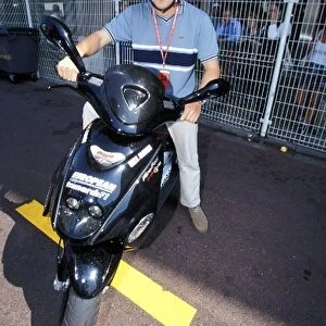 Monaco Grand Prix: Fernando Alonso with his moped