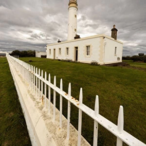 A White Fence Beside Barns Ness Lighthouse; Lothian, Scotland
