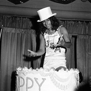 Alice Cooper American rock singer jumps out of a birthday cake 1975