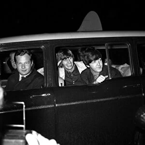 The Beatles July 1964 Paul McCartney and Ringo Starr greet fans as they arrive at