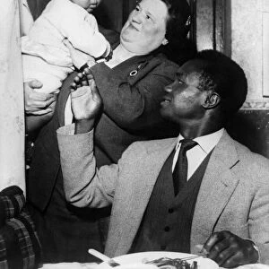 Boxer Hogan Bassey, pictured with Bessie Braddock at his home in Liverpool, Mrs