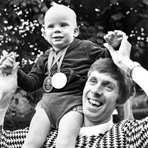 Brendan Foster with his 17 month old son Parul who is wearing his fathers two medals