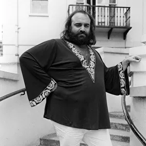 Demis Roussos July 1976 in London `Short Kaftan and white trousers