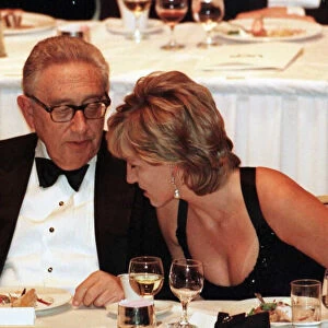 Diana, Princess of Wales with former US Secretary of State Henry Kissinger as she attends
