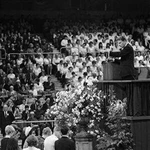 Evangelist Billy Graham addresses a crowd of 19000 people at Earls Court, London