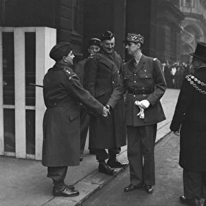General de Gaulle shakes the hand of a Home Guard officer, Lt-Col. John H. Lewis