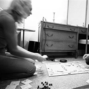 George Harrison enjoys a game of Monopoly with singer songwriter Jackie de Shannon