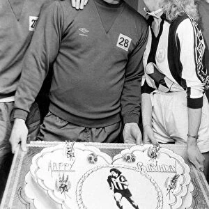 Kevin Keegan gets his birthday kiss from Julie Parkinson watched by team mate Terry