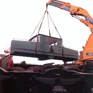 A lottery grant facelift begins for the 1909 Siemens locomotive as its is lifted on to a