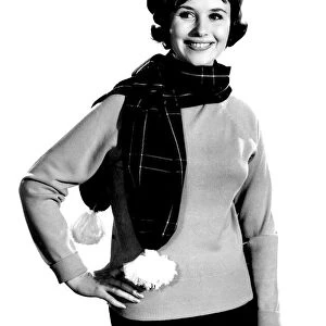 Model Ann Cave wearing scarf and matching hat. February 1962