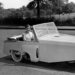 Model Pat Moss seen here in a Bond thre wheeled motor car. July 1955 P000004