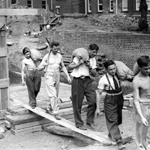 Newport Secondary School boys and their master fill sandbags. 15th September 1939