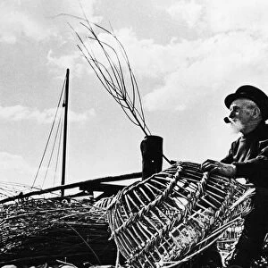 An old man of the Sea This old tar fisherman mends lobster pots at