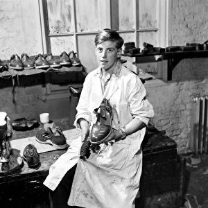 Orphan boy training to be a cobbler. December 1953 D7472A