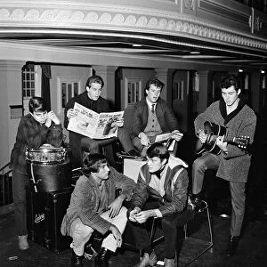 Pop singer Tommy Roe (front right) with his group The Roemans waiting on their packed