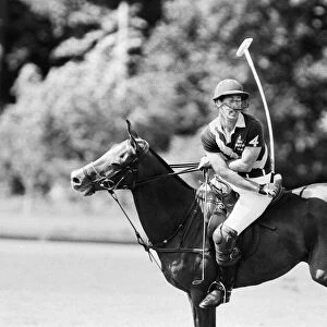 Prince Charles, the Prince of Wales in action for his polo team "