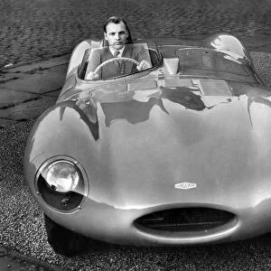 Racing driver Brian Naylor seen here behind the wheel of a D-type Jaguar