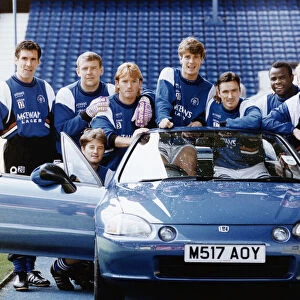 The Rangers first team try out a Honda for size at the launch of the £