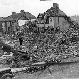 Residents of a bombed-out road in Henleaze recover clothing