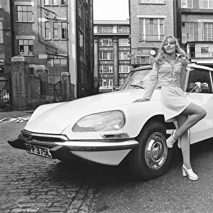 Reveille model seen here posing with a Citroen DS car which is a top prize in