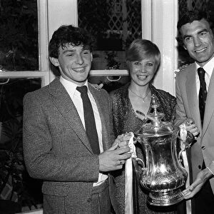 Seventeen years old Paul Allen poses with the FA Cup with Trevor Brooking
