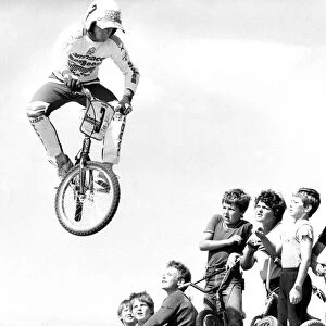 Startled BMX children watch as Pete Middleton demonstrates his skill