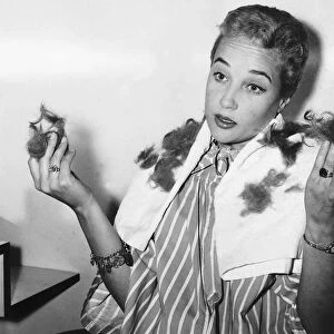 Sylvia Syms Actress having her hair trimmed - September 1959