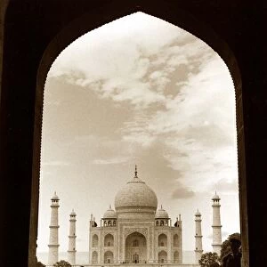 The Taj Mahal in India seen through the Arch - Front view of Building