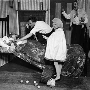 Wolf in bed in a scene from the play Red Riding Hood. 21 December 1930