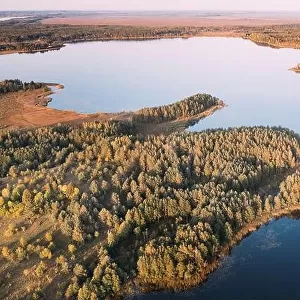 Braslaw District, Vitebsk Voblast, Belarus. Aerial View Of Ikazn Lake, Green Forest Landscape. Top View Of Beautiful European Nature From High