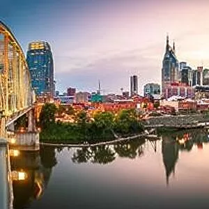 Nashville, Tennessee, USA downtown city skyline at dusk on the Cumberland River