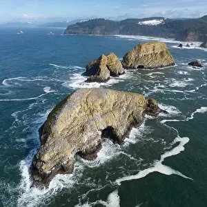 Sunlight shines on rugged sea stacks off the northern coast of Oregon, not far from Tillamook. This coastline has many outstanding viewpoints