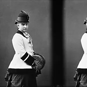 Stereoscopic photograph portraying a young woman in elegant nineteenth century dress