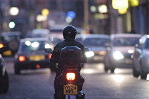 Scooter in traffic at night current contemporary moving motorbike Scooter in traffic at night current contemporary moving motorbike