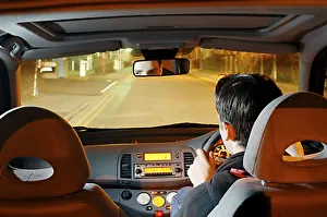 Young driver at night current contemporary moving Young driver at night current contemporary moving