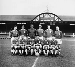 Liverpool team pose for a group picture on the pitch at Anfield before the start of